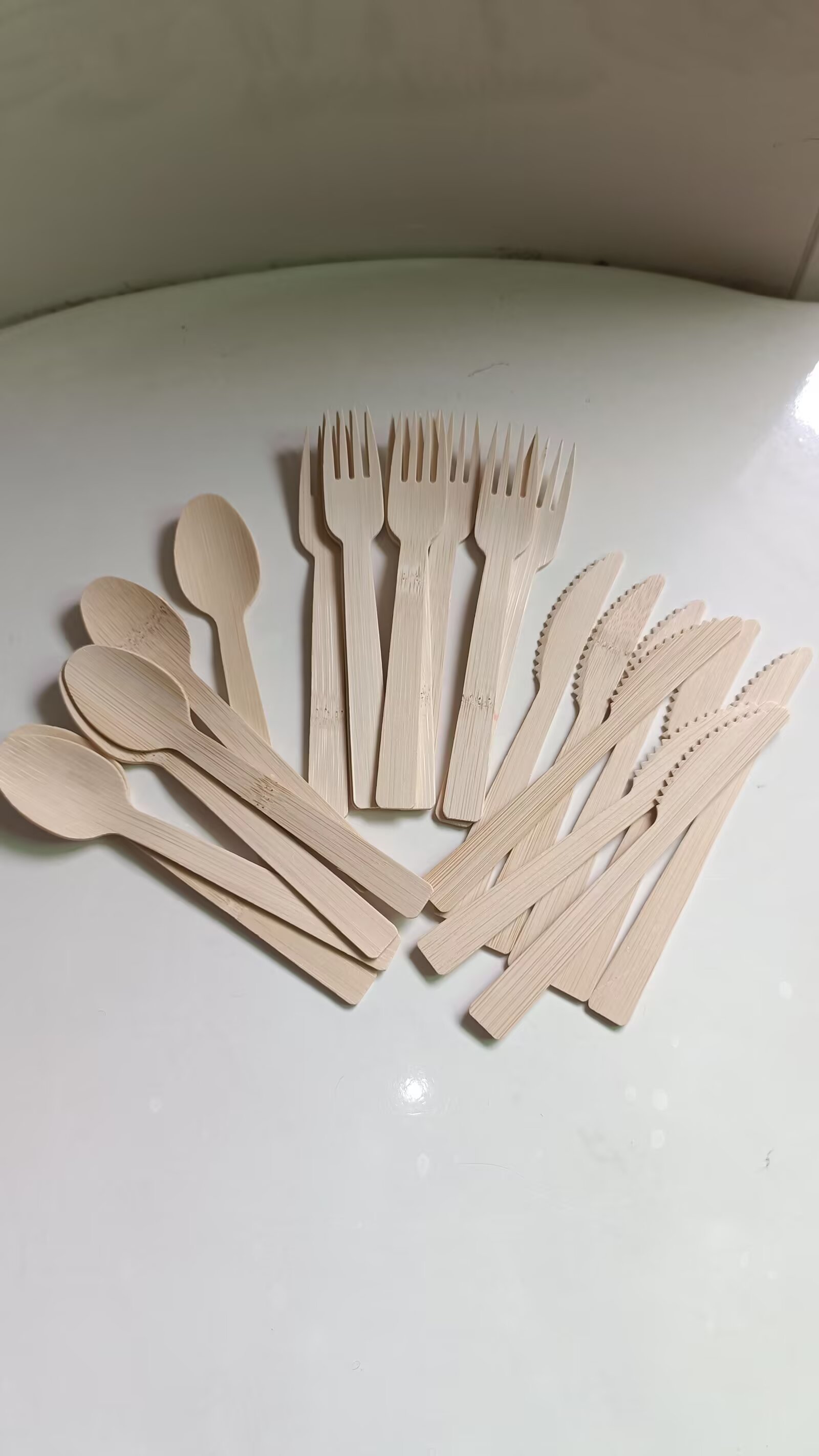 Bamboo tea tools on a wooden tray — scoop, tongs, strainer
